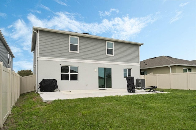 back of property featuring a patio area, a yard, a fenced backyard, and stucco siding