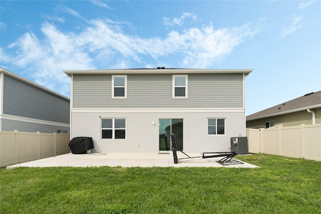 back of property with central AC, a patio, a fenced backyard, and a lawn