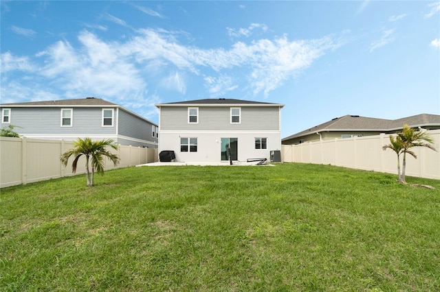 back of house featuring a fenced backyard, cooling unit, a lawn, and a patio