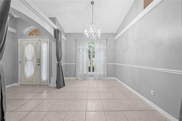 3303 Ann Arbor Ct, Saint Cloud, FL 34772 - foyer entrance with light tile patterned floors, baseboards, an inviting chandelier, and vaulted ceiling
