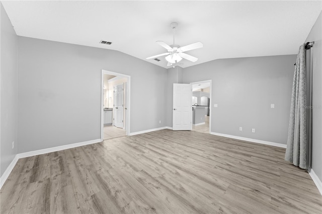 3303 Ann Arbor Ct, Saint Cloud, FL 34772 - unfurnished bedroom with lofted ceiling, light wood-style flooring, baseboards, and visible vents