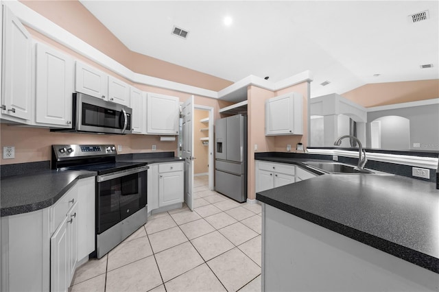 3303 Ann Arbor Ct, Saint Cloud, FL 34772 - kitchen featuring dark countertops, visible vents, appliances with stainless steel finishes, and a sink