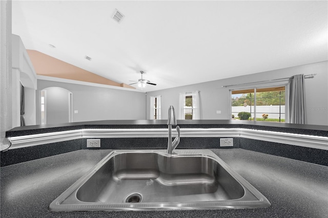 3303 Ann Arbor Ct, Saint Cloud, FL 34772 - details with visible vents, ceiling fan, a sink, arched walkways, and dark countertops