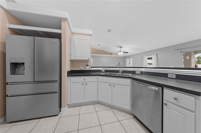 3303 Ann Arbor Ct, Saint Cloud, FL 34772 - kitchen featuring dark countertops, appliances with stainless steel finishes, ceiling fan, and a sink