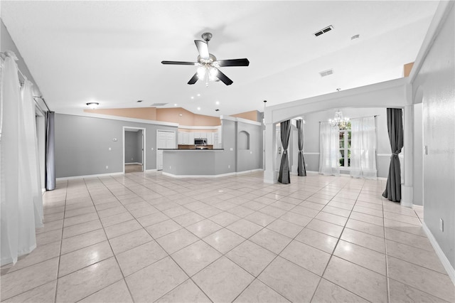 3303 Ann Arbor Ct, Saint Cloud, FL 34772 - unfurnished living room with light tile patterned floors, baseboards, visible vents, ceiling fan with notable chandelier, and vaulted ceiling