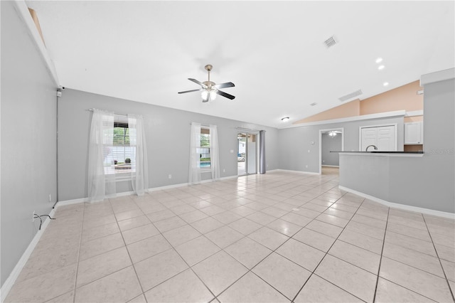 3303 Ann Arbor Ct, Saint Cloud, FL 34772 - unfurnished living room featuring a ceiling fan, lofted ceiling, baseboards, visible vents, and light tile patterned flooring
