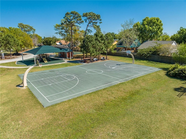 3303 Ann Arbor Ct, Saint Cloud, FL 34772 - view of basketball court featuring community basketball court, playground community, fence, and a lawn