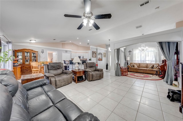 3303 Ann Arbor Ct, Saint Cloud, FL 34772 - living room with visible vents, light tile patterned flooring, ceiling fan with notable chandelier, vaulted ceiling, and arched walkways