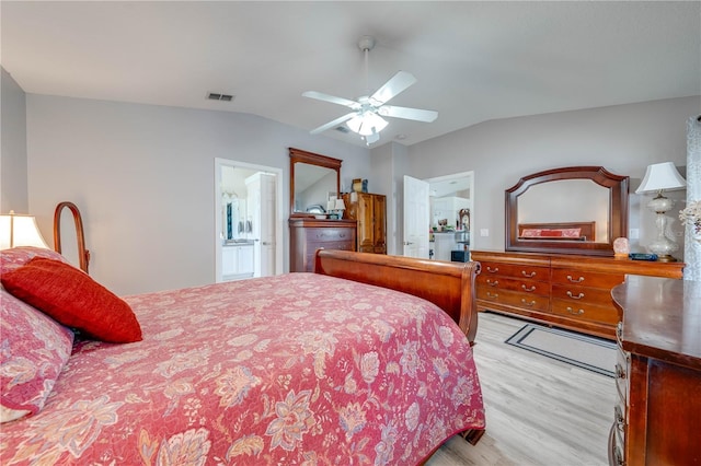 3303 Ann Arbor Ct, Saint Cloud, FL 34772 - bedroom featuring light wood-style flooring, visible vents, ceiling fan, ensuite bath, and lofted ceiling
