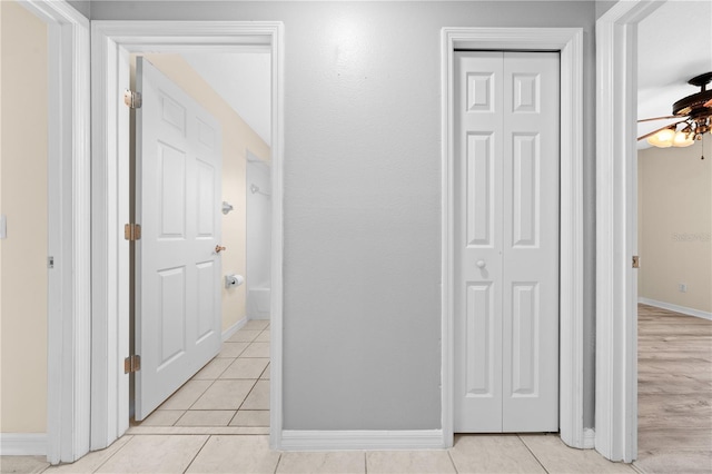 3303 Ann Arbor Ct, Saint Cloud, FL 34772 - corridor featuring baseboards and light tile patterned flooring