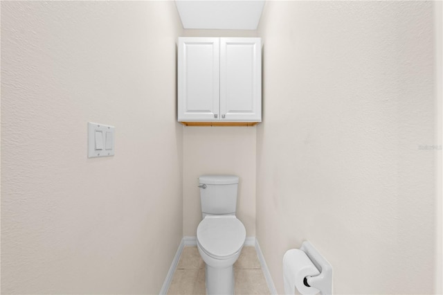 3303 Ann Arbor Ct, Saint Cloud, FL 34772 - bathroom with tile patterned floors, toilet, and baseboards