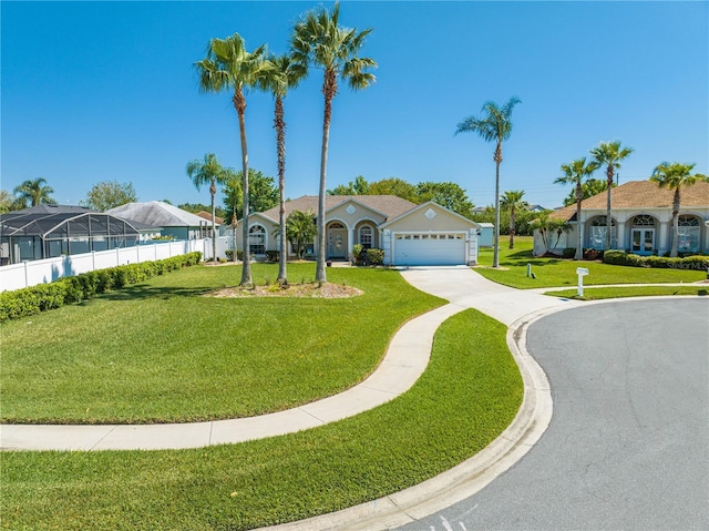 3303 Ann Arbor Ct, Saint Cloud, FL 34772 - view of front of property featuring driveway, a front lawn, and an attached garage