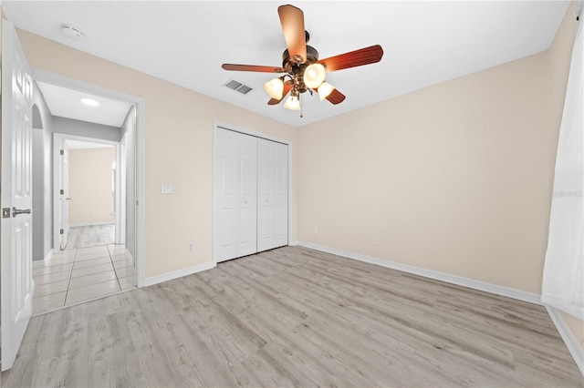 3303 Ann Arbor Ct, Saint Cloud, FL 34772 - unfurnished bedroom featuring baseboards, light wood-style floors, a closet, and visible vents