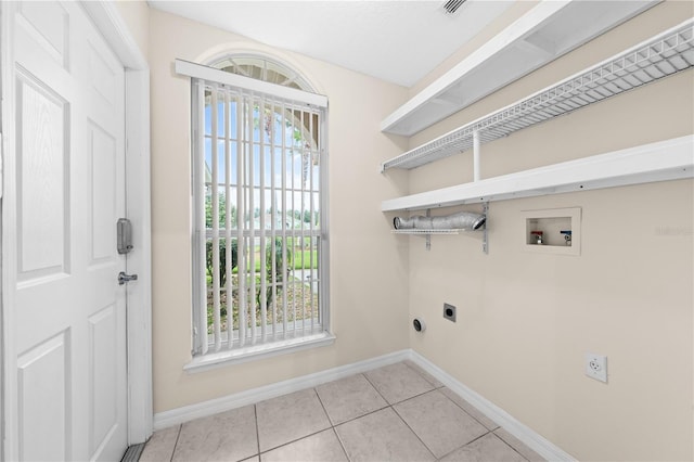 3303 Ann Arbor Ct, Saint Cloud, FL 34772 - washroom featuring laundry area, washer hookup, hookup for an electric dryer, baseboards, and light tile patterned flooring