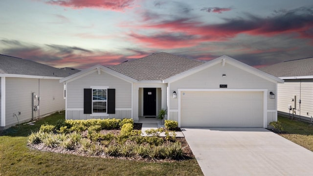 view of front of home featuring an attached garage, a shingled roof, and concrete driveway