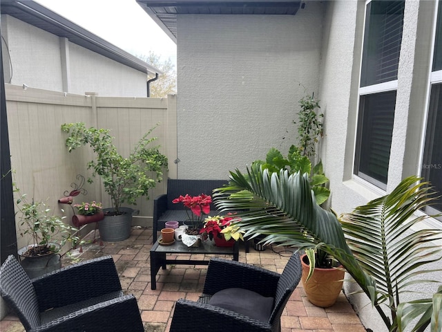 view of patio featuring fence