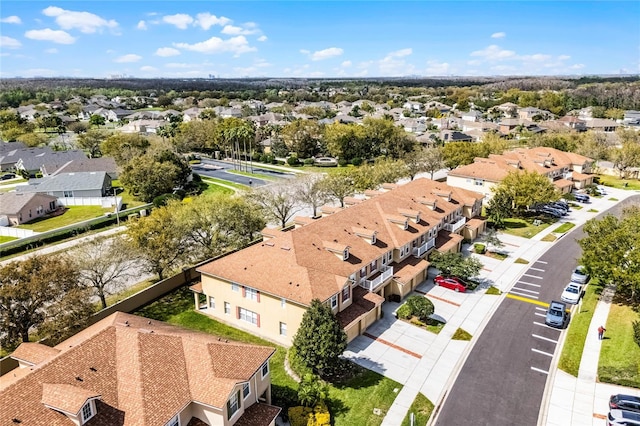 birds eye view of property with a residential view