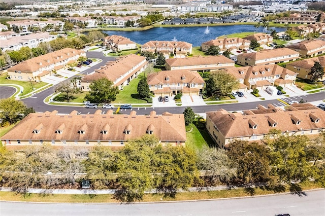 bird's eye view featuring a water view and a residential view