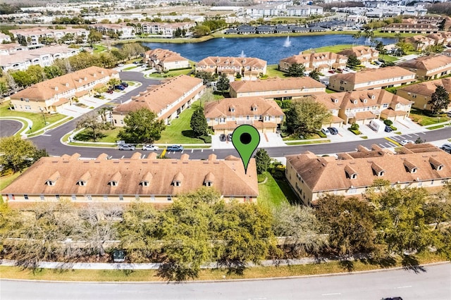 bird's eye view with a residential view and a water view