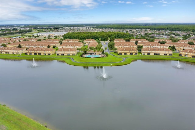 drone / aerial view featuring a residential view and a water view