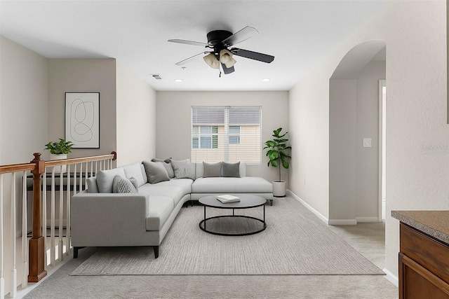 3102 Ashland Ln N Unit 3152, Kissimmee, FL 34741 - living area with a ceiling fan, light colored carpet, and arched walkways