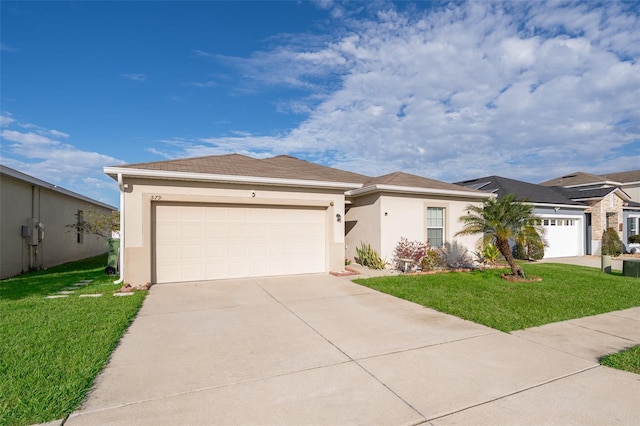 view of front of home with an attached garage, driveway, a front lawn, and stucco siding