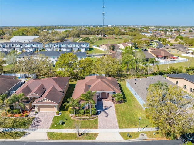 birds eye view of property with a residential view