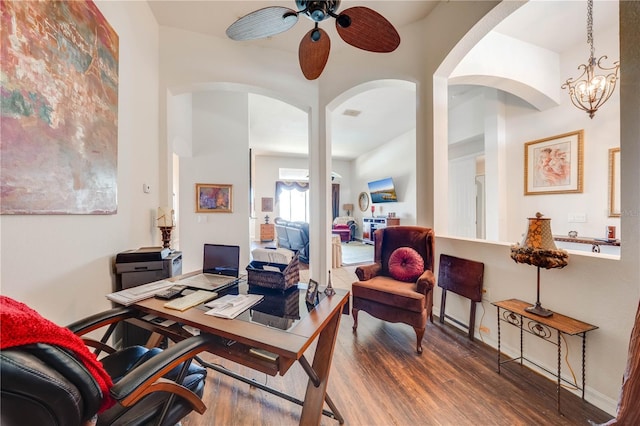 home office featuring ceiling fan, baseboards, and wood finished floors