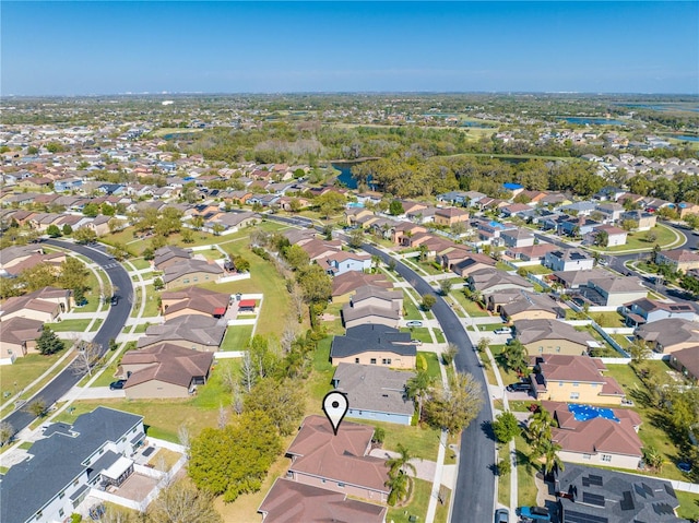 birds eye view of property with a residential view