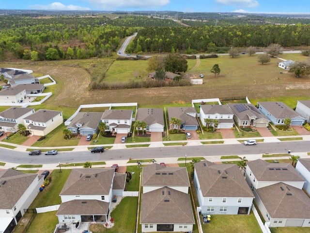 bird's eye view with a residential view and a view of trees