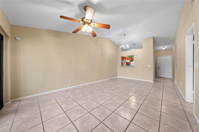unfurnished living room featuring light tile patterned flooring, a chandelier, ceiling fan, lofted ceiling, and baseboards