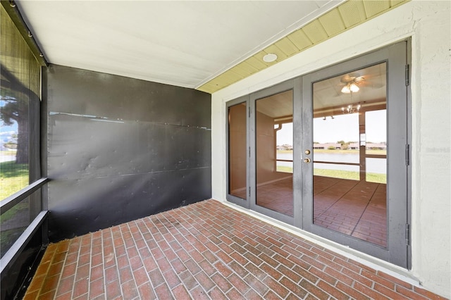 unfurnished sunroom with french doors