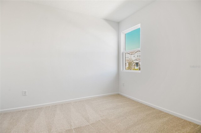 2985 Gavin Sky Dr, Kissimmee, FL 34744 - empty room featuring carpet and baseboards