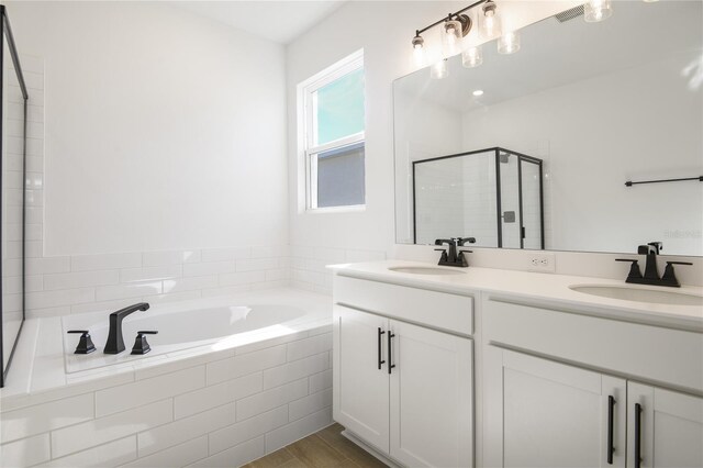 2985 Gavin Sky Dr, Kissimmee, FL 34744 - full bathroom with double vanity, a sink, a shower stall, and a bath
