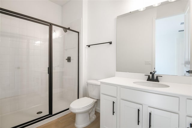2985 Gavin Sky Dr, Kissimmee, FL 34744 - full bathroom with a stall shower, vanity, toilet, and wood finished floors