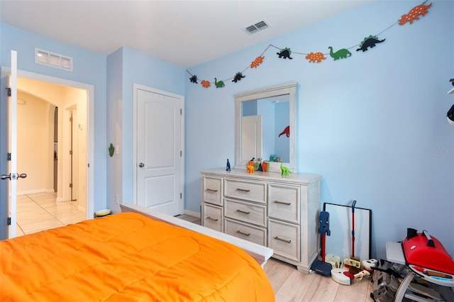 bedroom featuring visible vents