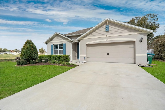 ranch-style home featuring stucco siding, concrete driveway, a garage, and a front lawn
