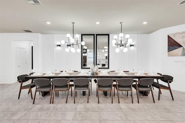 dining space with a notable chandelier, light tile patterned flooring, visible vents, and recessed lighting