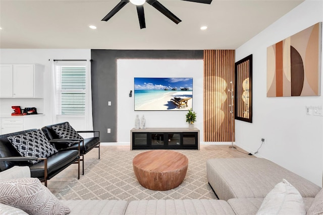 living area featuring a ceiling fan, recessed lighting, and baseboards