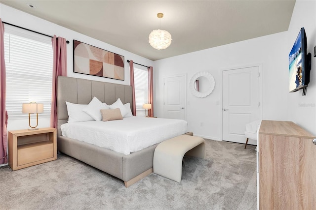 bedroom with carpet floors and baseboards