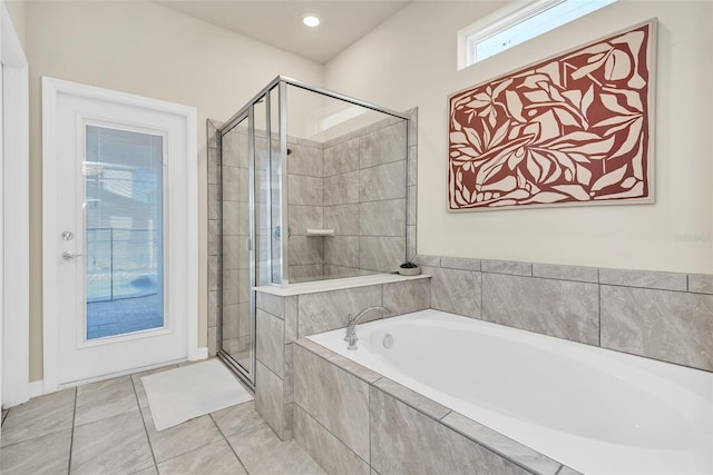 full bathroom with a stall shower, tile patterned flooring, and a garden tub