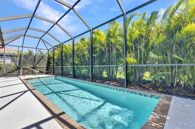 outdoor pool featuring a patio and a lanai