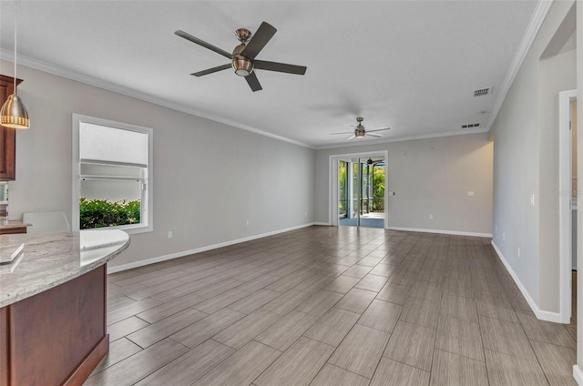 unfurnished living room featuring a ceiling fan, crown molding, baseboards, and visible vents