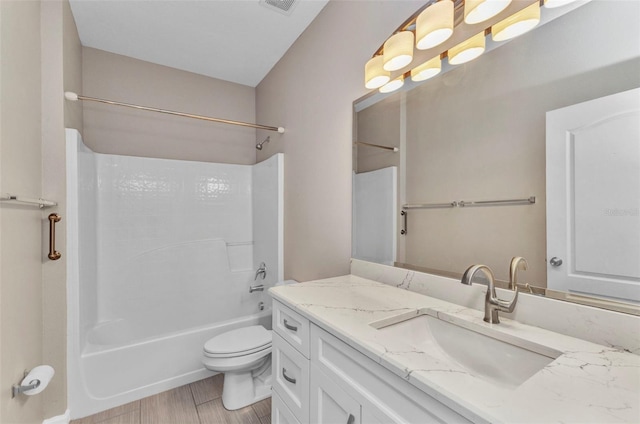 full bath featuring visible vents, toilet, vanity, and shower / washtub combination