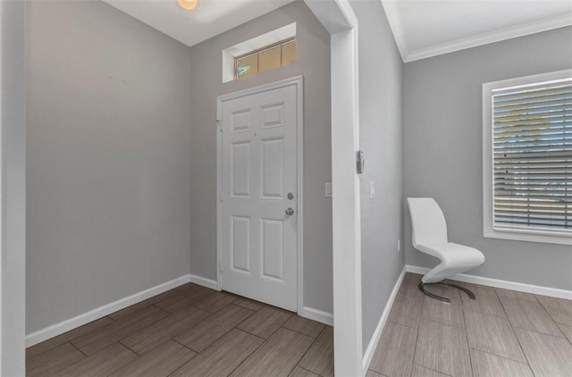 foyer entrance featuring wood finish floors and baseboards