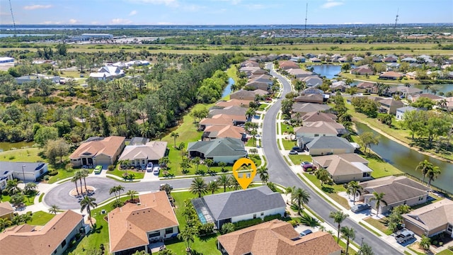 aerial view with a water view and a residential view