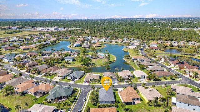 birds eye view of property with a residential view and a water view