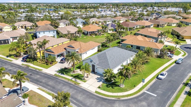 birds eye view of property with a residential view