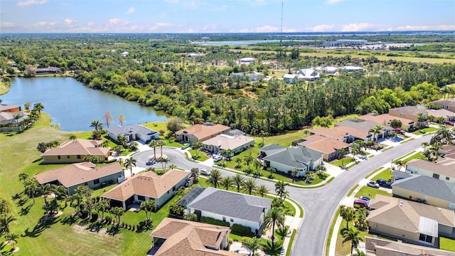 aerial view with a residential view and a water view