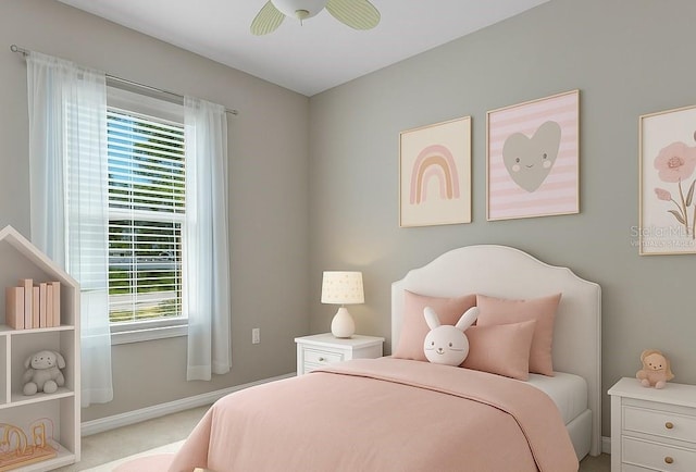 bedroom with a ceiling fan, carpet, and baseboards